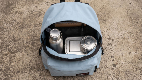 Schoolstart Trio packed in a school backpack — 800 ml lunch box, 480 ml snack pot and 500 ml steel bottle